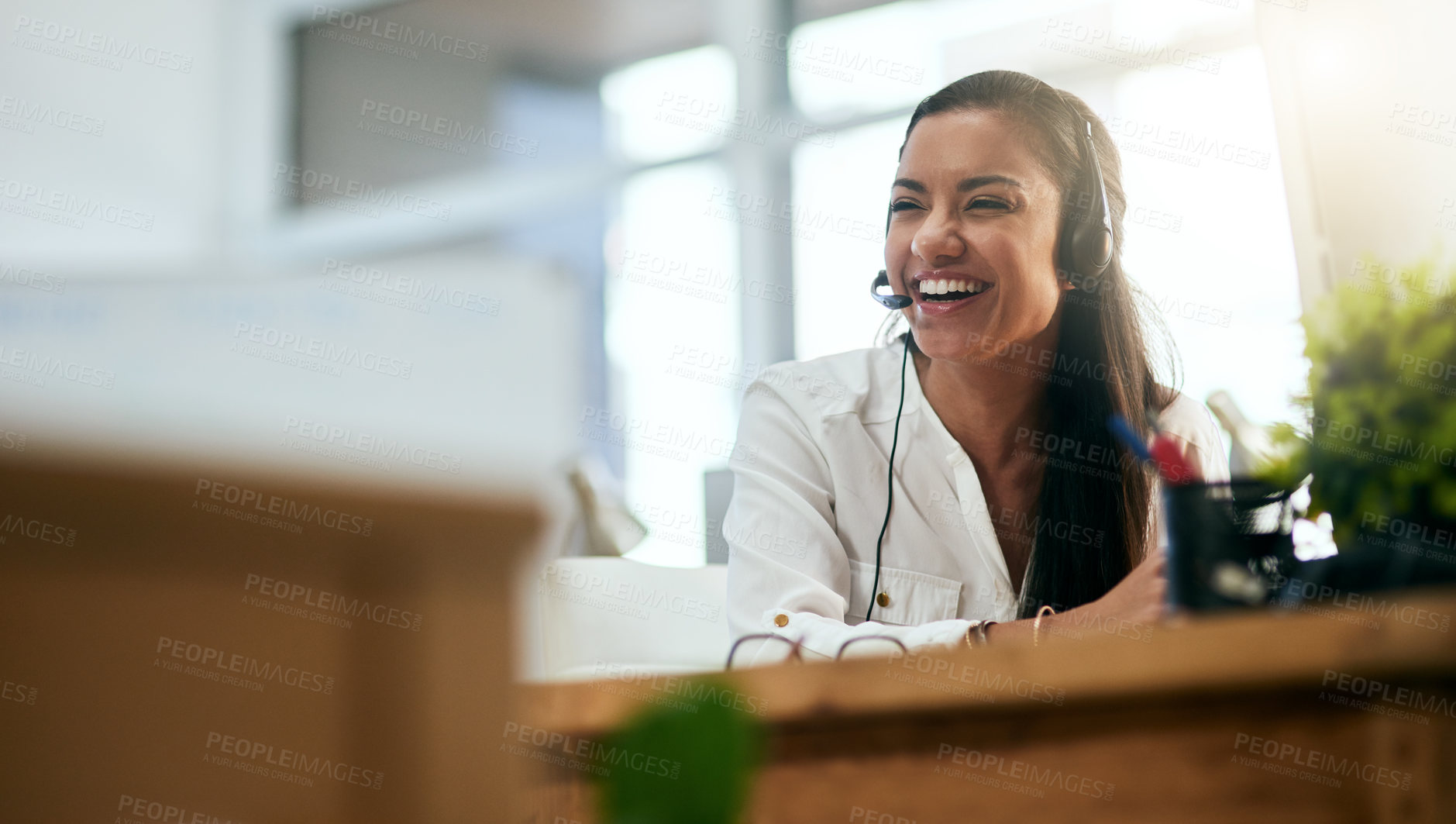 Buy stock photo Laughing, virtual assistant or happy woman in call center consulting, speaking or talking at help desk. Smile, friendly or funny sales consultant in telemarketing customer services or telecom company