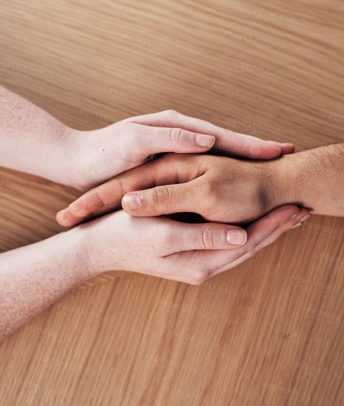 Buy stock photo Connection, above and couple holding hands on table for empathy, compassion and kindness at home. People, trust and marriage with comfort in partnership for commitment, understanding and forgiveness