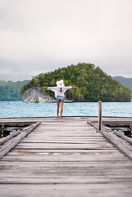 Buy stock photo Island, ocean and woman with freedom on boardwalk for holiday, summer vacation and weekend in Maldives. Travel, tropical sea and female person on luxury resort for carefree, happiness and relaxing