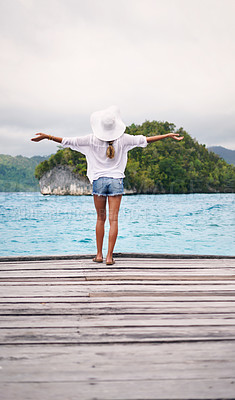 Buy stock photo Island, tropical ocean and back of woman on deck for holiday, summer vacation and getaway in Maldives. Travel, relax and female person on luxury resort for tourist destination, freedom and adventure