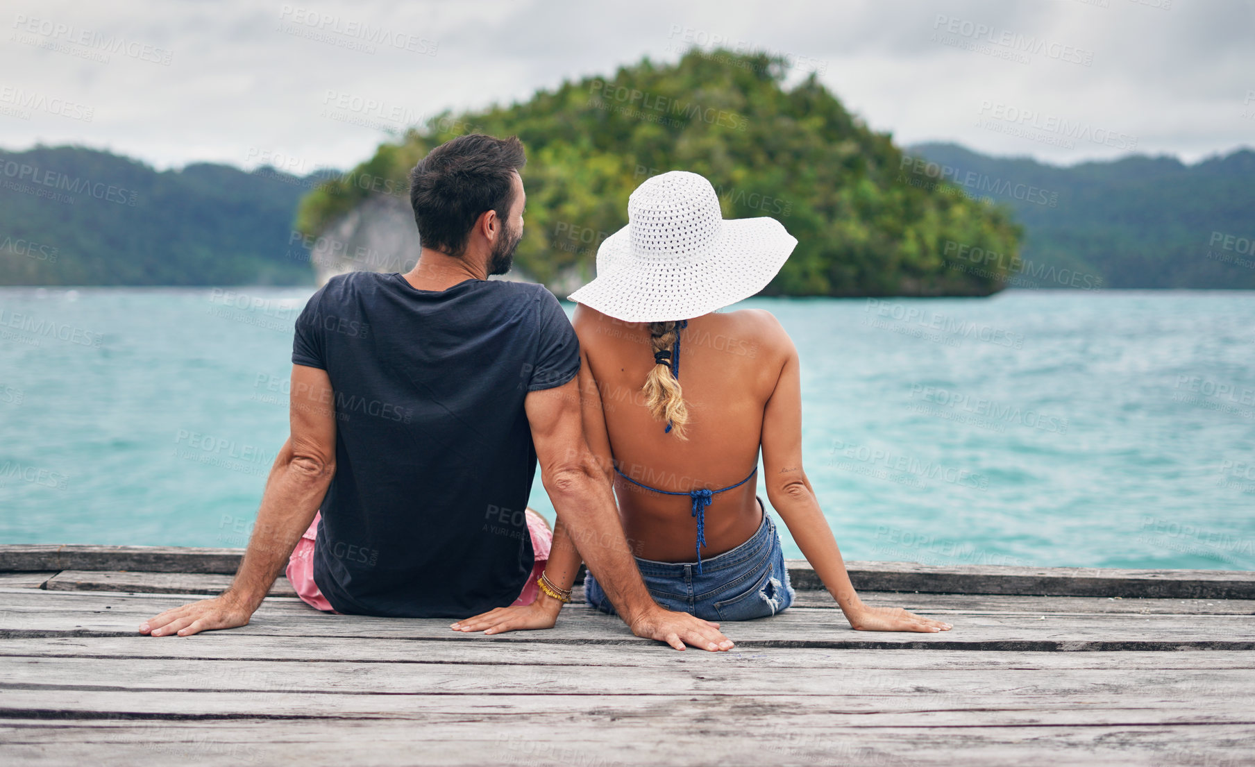 Buy stock photo Back, couple and vacation together on ocean deck, dock or sitting on boardwalk to relax or enjoy the sea or water landscape. People, man and woman on holiday, summer travel or date in tropical nature