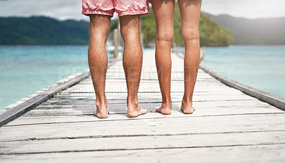 Buy stock photo Travel, island and legs of couple on deck for holiday, summer vacation and weekend in Maldives. Love, tropical and man and woman standing on luxury resort for honeymoon, anniversary and adventure