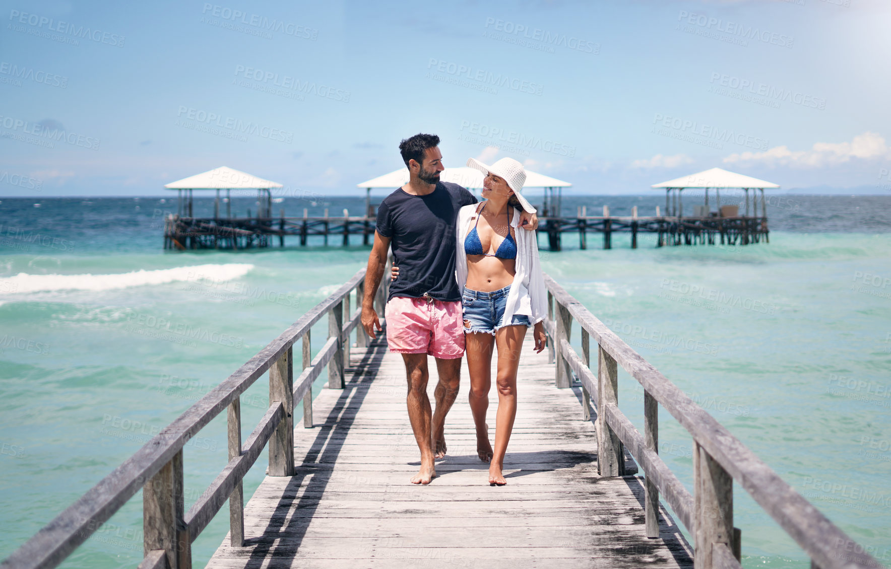 Buy stock photo Couple smile, walking and travel on a tropical island on vacation with freedom by sea. Ocean, beach and deck walk of a man back and woman together with love in summer on a holiday outdoor in sun