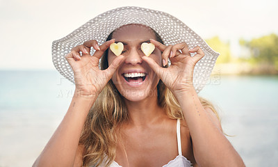 Buy stock photo Beach, smile and woman with pineapple by face on holiday for tropical, vacation or diet on trip. Summer, happy and person with fruit in heart shape by ocean for nutrition, health and travel in Greece