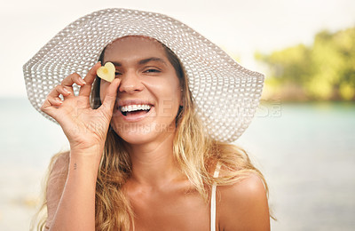 Buy stock photo Beach, portrait and woman with pineapple by face on vacation for tropical, holiday or and nutrition. Summer, happy and person with fruit in heart shape by ocean for diet, health and travel in Greece