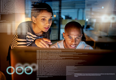 Buy stock photo Shot of colleagues connecting to a user interface while working in an office at night