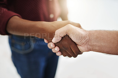 Buy stock photo Closeup handshake showing success, support and trust between collaborating businessmen. Fingers of creative office business colleagues making a deal and agreeing or welcoming, greeting and promoting