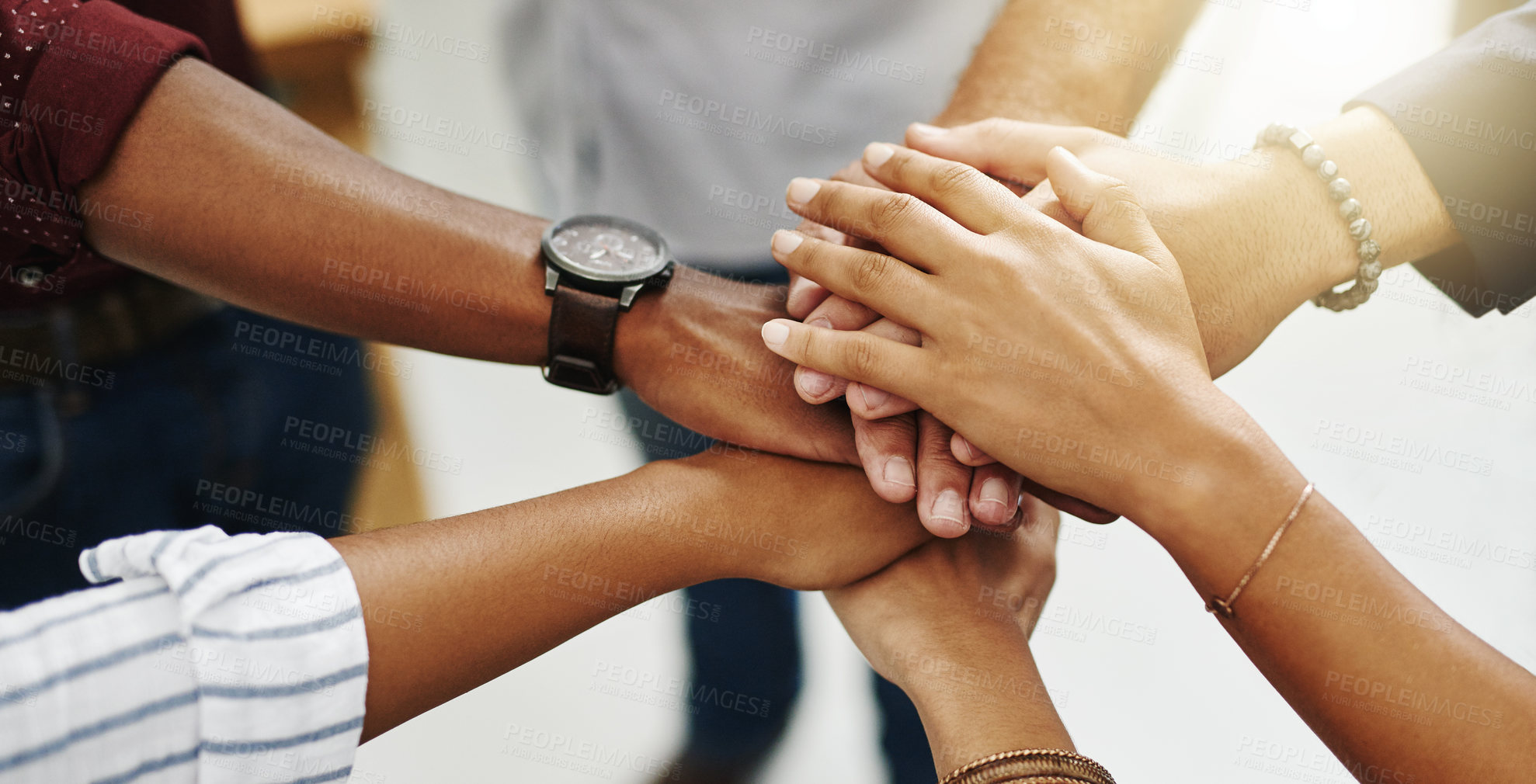 Buy stock photo Diverse people stacking or piling hands in teamwork, success and support to show solidarity, trust and unity in office. Closeup of business team, men and women standing together and feeling motivated