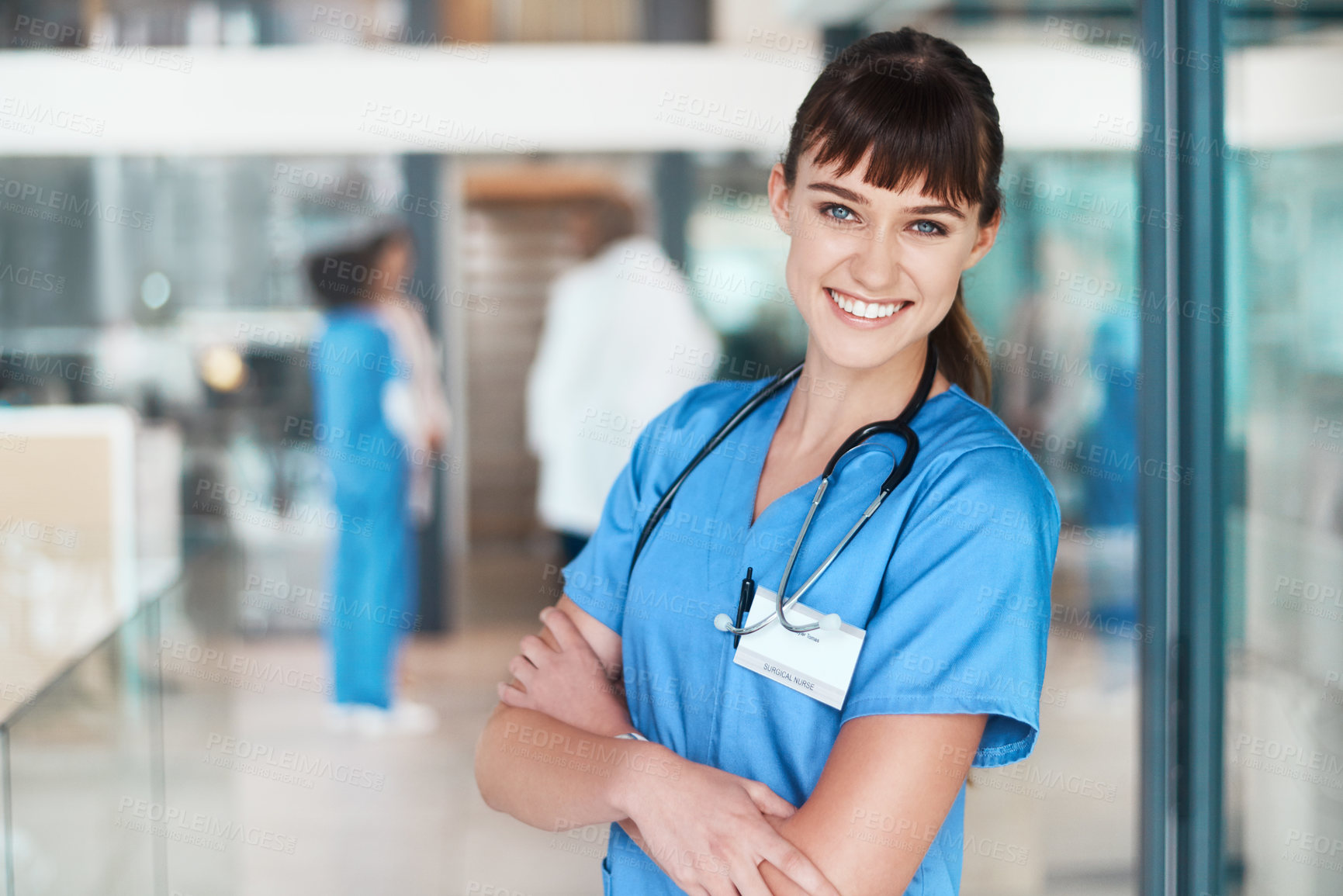 Buy stock photo Portrait, happy woman or nurse with arms crossed in clinic for healthcare services, career or medicine. Proud, medical professional or confident surgeon with smile at wellness hospital for nursing 