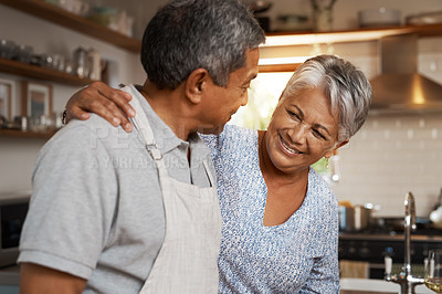 Buy stock photo Kitchen, happiness and old man with woman, embrace and healthy marriage bonding in home for dinner. Love, help and cooking, senior couple with smile, hug in apartment and happy time in retirement.