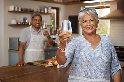 Buy stock photo Cheers, wine and portrait of old couple in kitchen cooking healthy food together in home with smile. Toast, drinks and senior woman with man, glass raised and happiness, diet meal prep and retirement