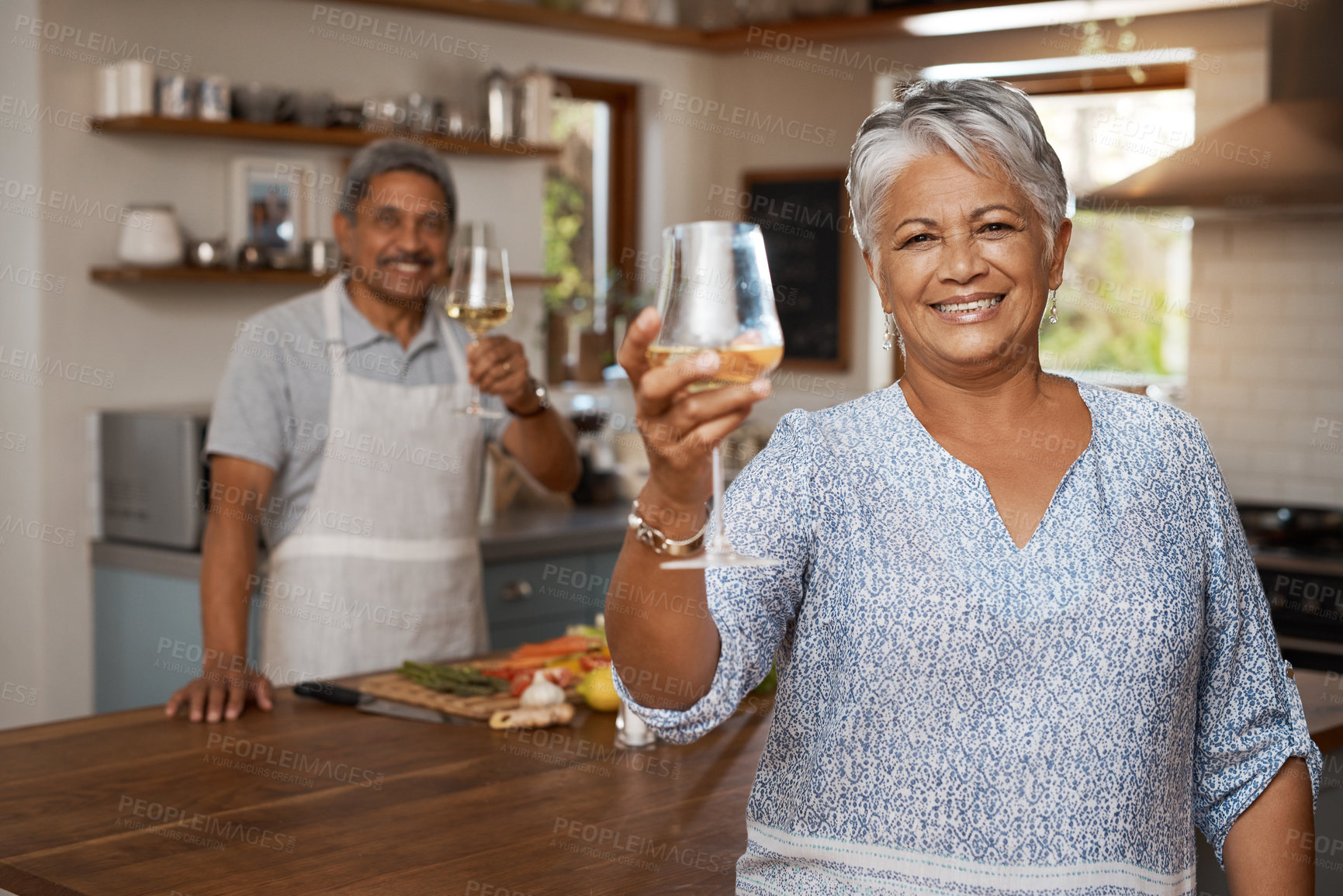 Buy stock photo Cheers, wine and portrait of old couple in kitchen cooking healthy food together in home with smile. Toast, drinks and senior woman with man, glass raised and happiness, diet meal prep and retirement