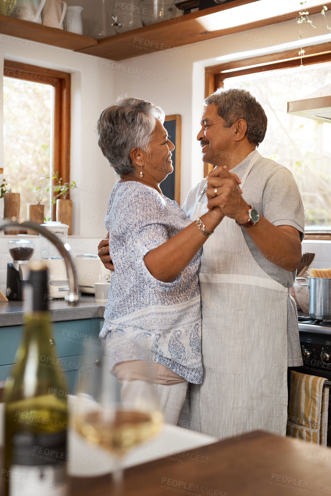 Buy stock photo Dance, happy and mature couple in kitchen for bonding, loving relationship and romance together in home. Retirement, marriage and senior man and woman with food for cooking meal, lunch and dinner