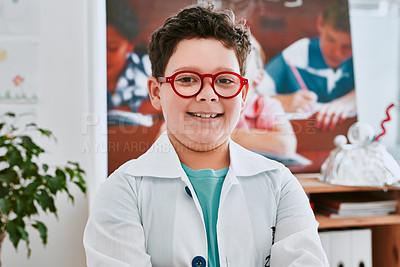 Buy stock photo Portrait of an adorable young school boy feeling cheerful in science class at school