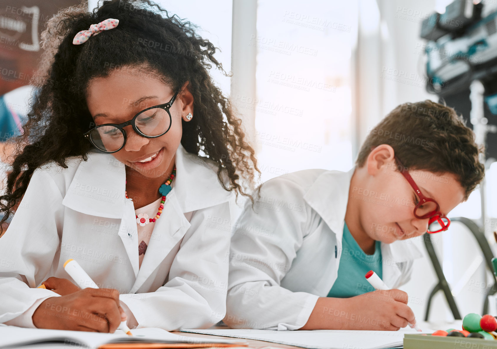 Buy stock photo Boy, girl and lab coat with writing at school with thinking, glasses or notes for learning in class. Children, notebook and education for science with idea for studying, growth or progress at academy