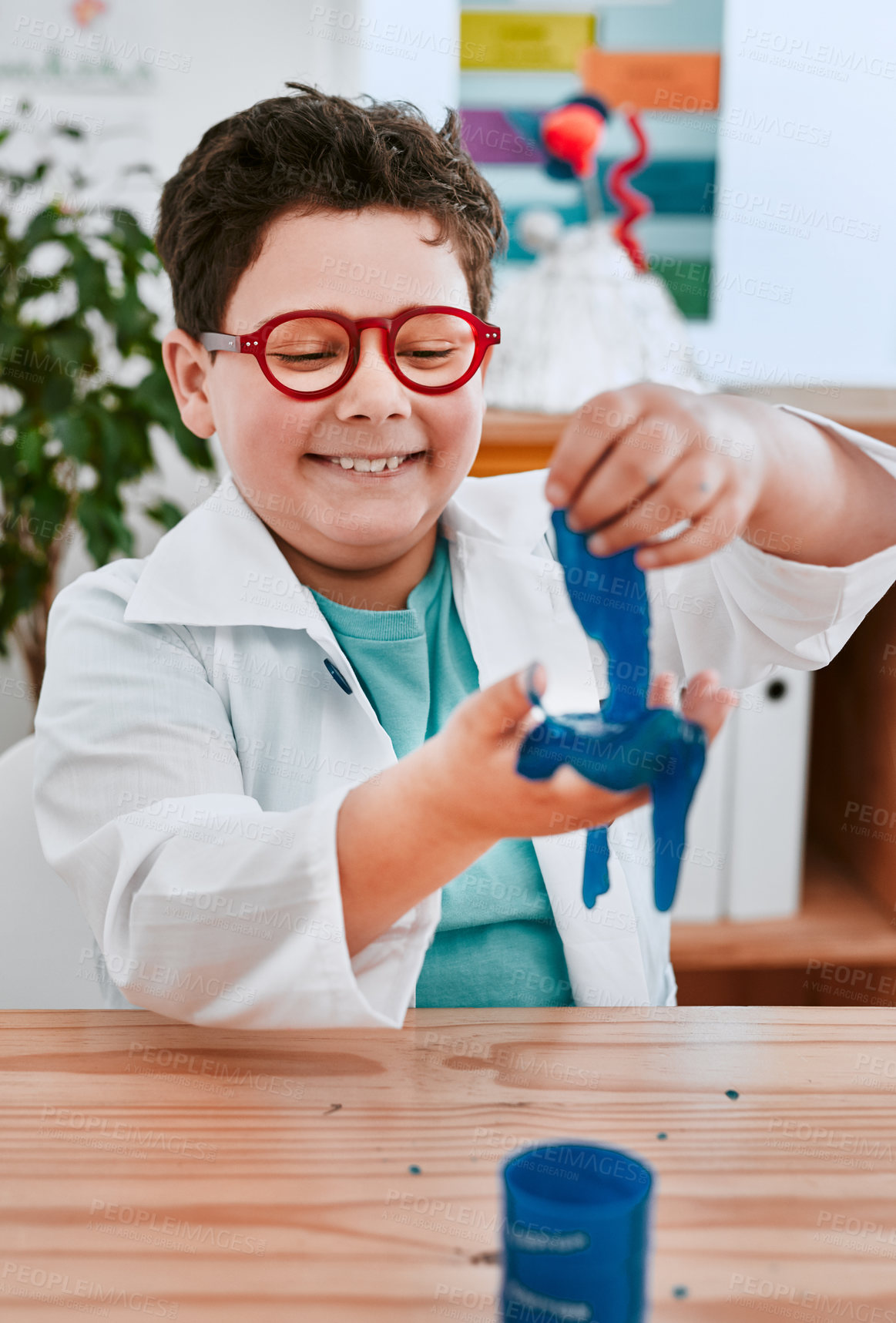 Buy stock photo Boy, happy and slime at school for science, thinking and playful with learning in classroom. Child, blue liquid and education for chemical with ideas for studying, growth and progress at academy