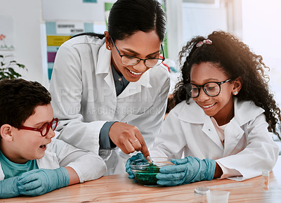 Buy stock photo Science, teacher and students in classroom with experiment, support and pride for learning. Chemistry, boy child and girl at school for research, solution and development or results for project