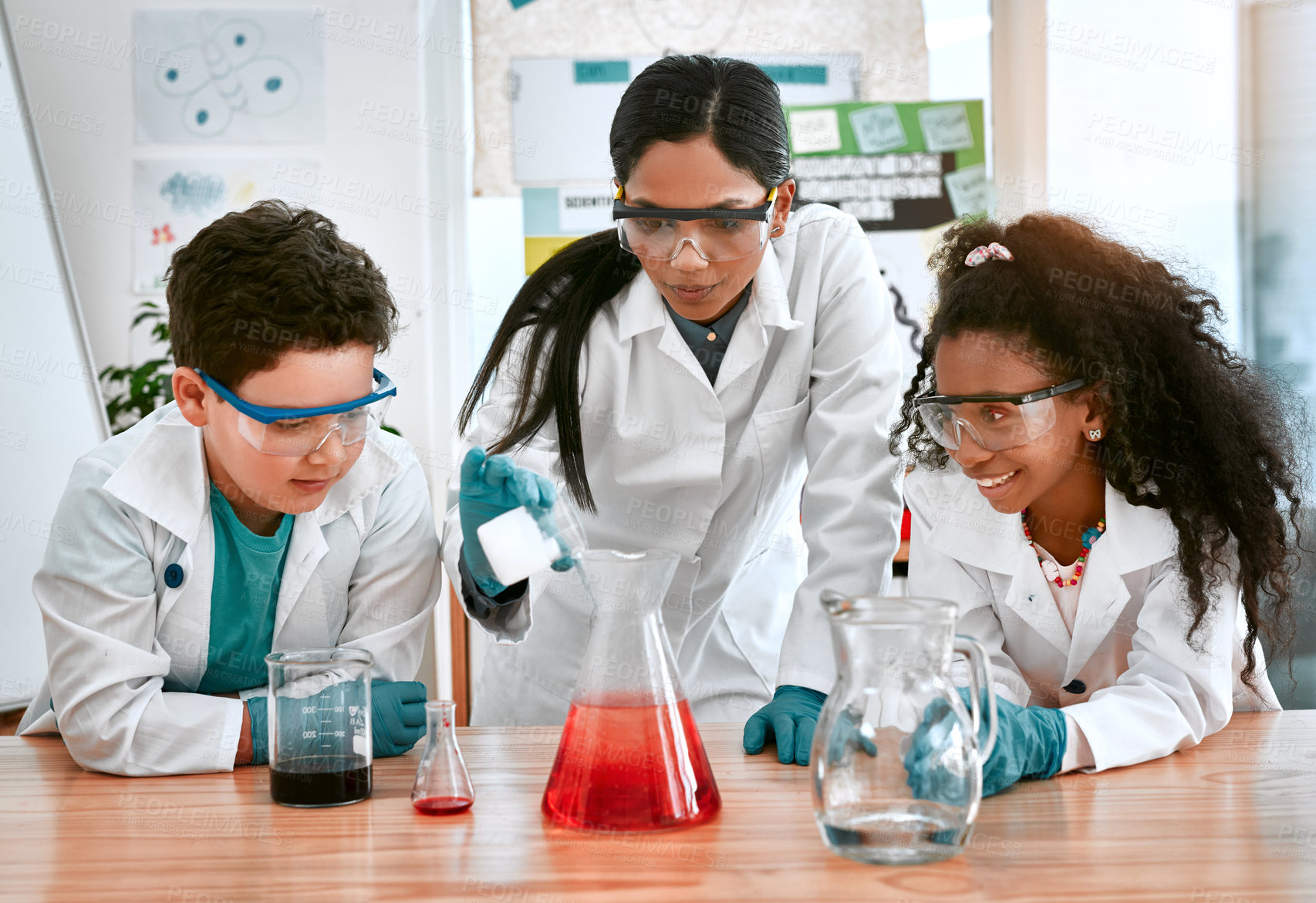 Buy stock photo Classroom, school or science with teacher and students at table in laboratory for experiment or reaction. Education, learning or study with woman scientist and children at academy for development