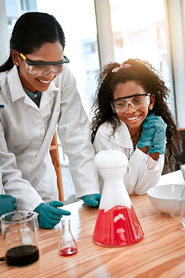 Buy stock photo Shot of an adorable little girl conducting a scientific experiment with her teacher at school