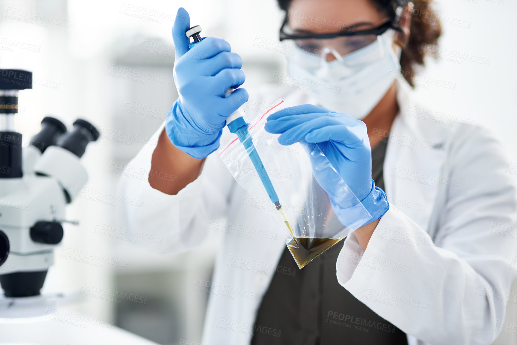 Buy stock photo Cropped shot of a scientist conducting an experiment in a modern laboratory