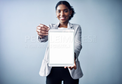 Buy stock photo Happy woman, portrait and tablet with mockup screen for advertising or marketing on a gray studio background. Female person or employee with technology, display or app for review or advertisement