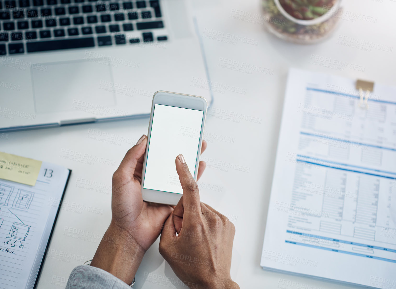 Buy stock photo Office, scroll and hands of woman with phone screen, mockup and financial planning online. ERP, business and person at desk with mobile app, connection or networking on website, smartphone or contact