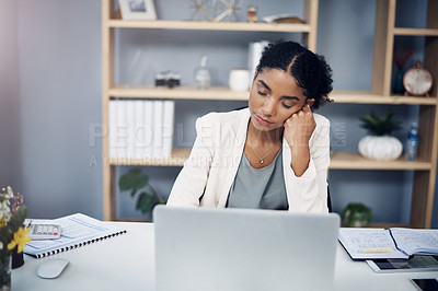 Buy stock photo Tired, burnout and overworked woman working on a laptop in an office, sleepy and taking a nap. Young female suffering from fatigue and low energy, unfocused and struggling to manage an online task