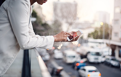 Buy stock photo Phone in the hands of a woman for communication, networking and calling while standing on a balcony above a urban city street. Corporate professional taking a break and browsing on a mobile app