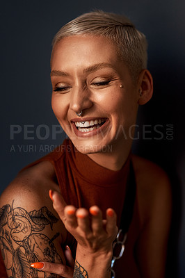 Buy stock photo Young woman, happy laugh and tattoo with hipster and gen z fashion with a smile and piercing. Cool style, face and cosmetics of a female person with happiness, confidence and jewelry wearing makeup