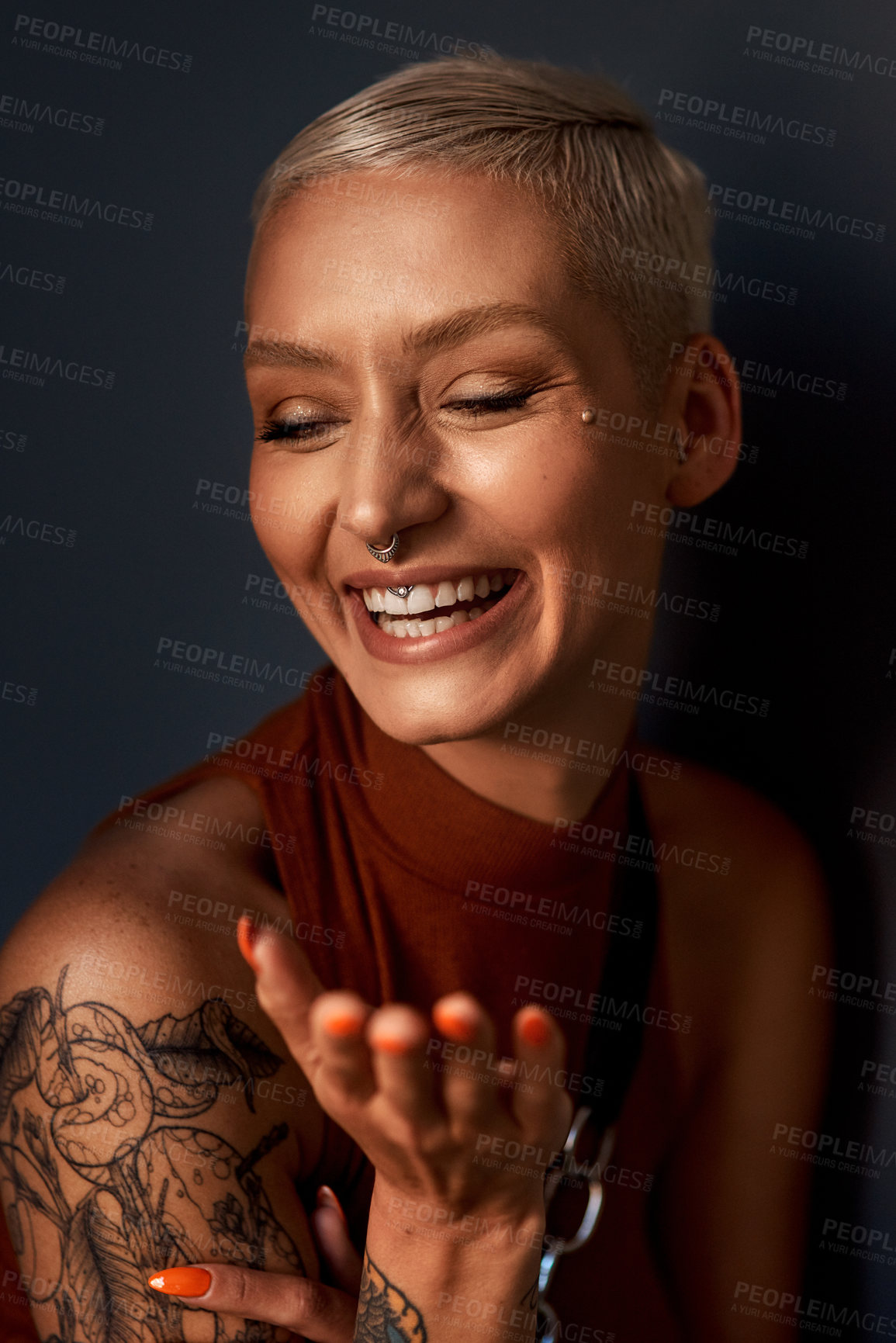 Buy stock photo Young woman, happy laugh and tattoo with hipster and gen z fashion with a smile and piercing. Cool style, face and cosmetics of a female person with happiness, confidence and jewelry wearing makeup
