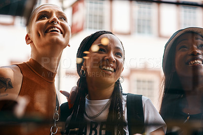 Buy stock photo Shot of three close friends spending the day together in the city