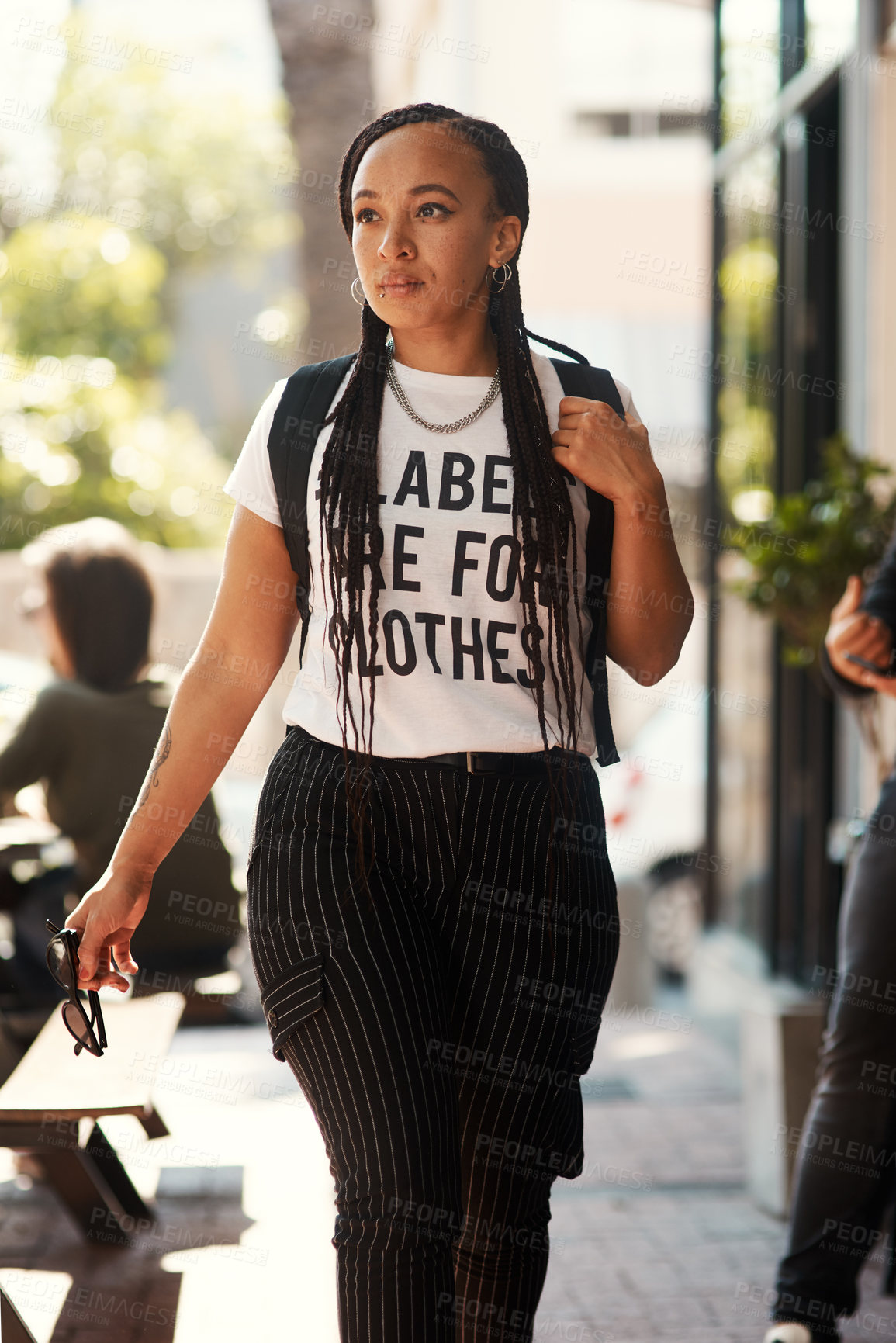 Buy stock photo African woman, student and walking in city with thinking, backpack and direction on commute to college. Girl, person and outdoor on metro sidewalk for travel to university with streetwear in summer