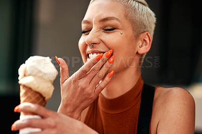 Buy stock photo Cropped shot of a young woman enjoying a ice cream cone outdoors