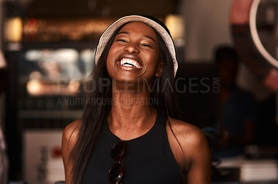 Buy stock photo Cropped shot of a happy young woman in a cafe