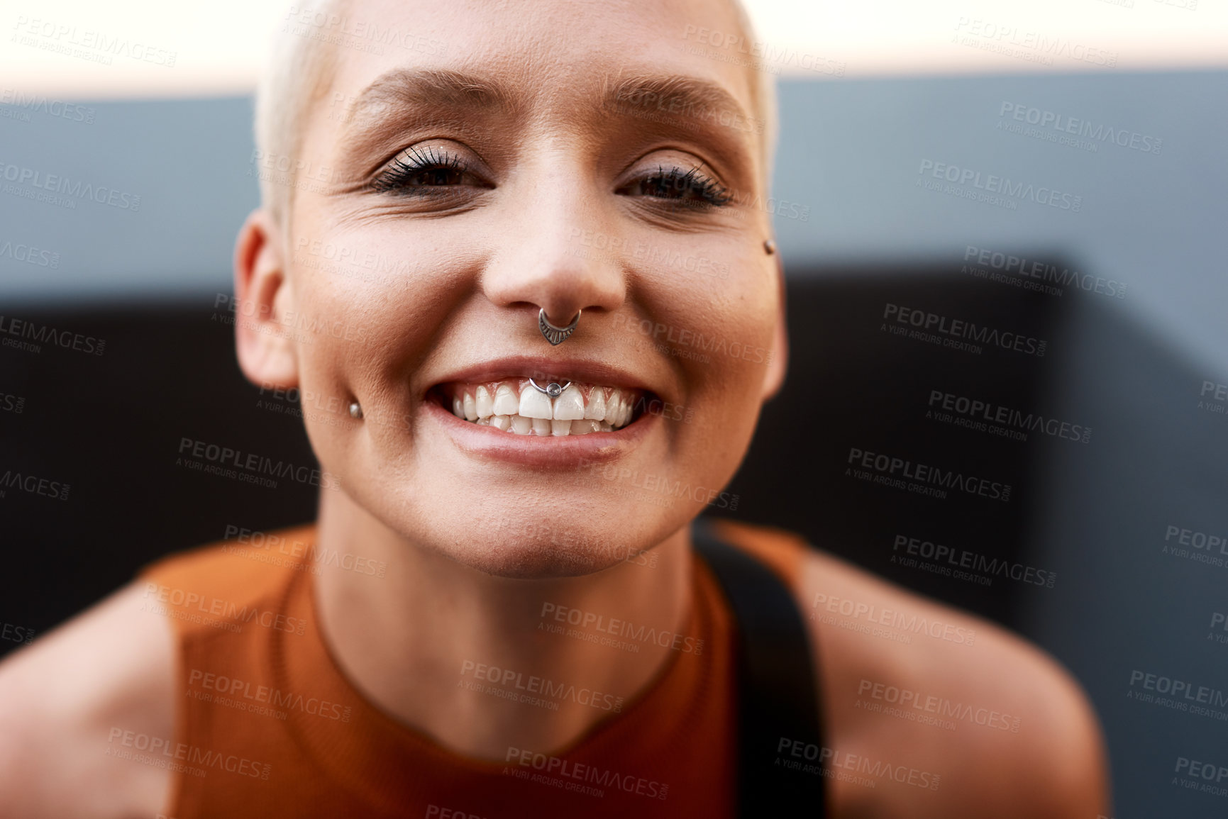 Buy stock photo Closeup portrait of an attractive young woman feeling confident and cheerful while relaxing outdoors
