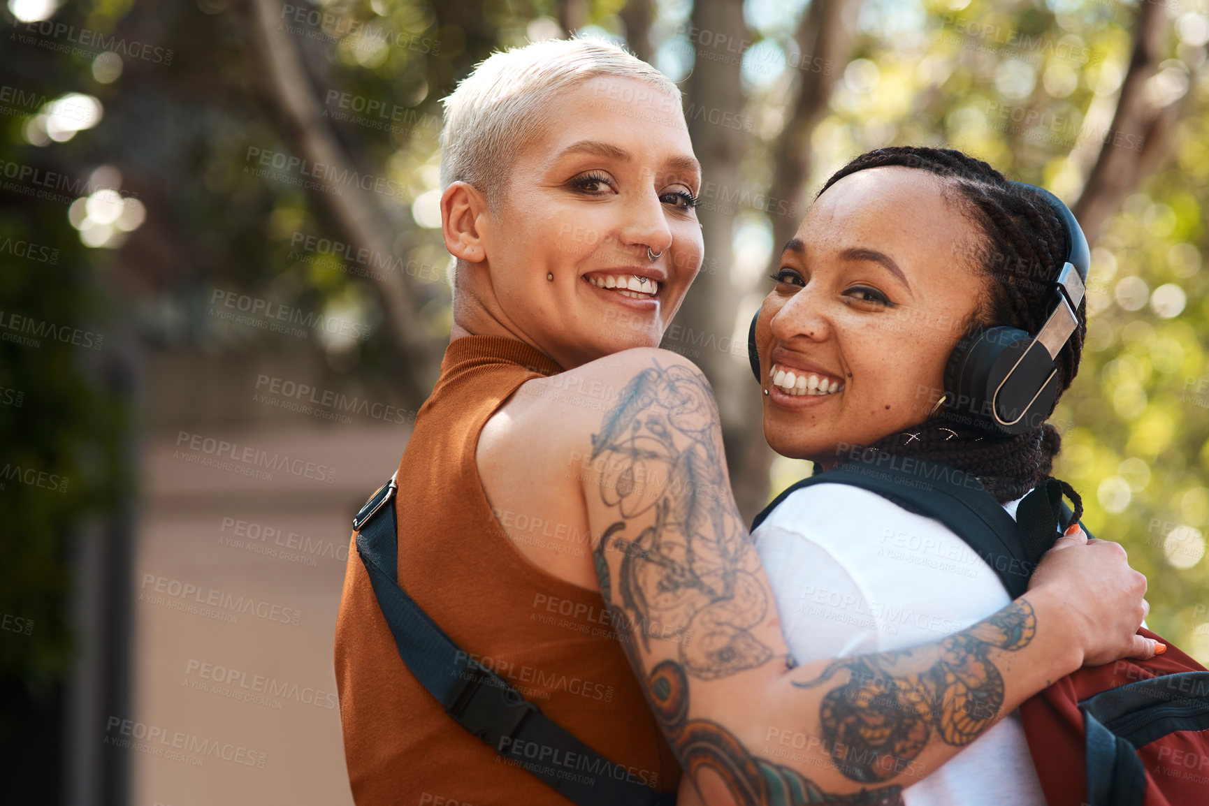 Buy stock photo Cropped shot of two friends spending the day out in the city