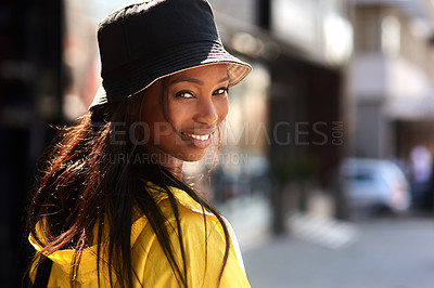 Buy stock photo Cropped shot of a young woman walking through the city