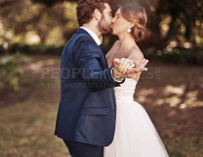 Buy stock photo Happy, married and couple with kiss on wedding day in garden for celebration, ceremony and commitment in summer. Smile, woman and man with for relationship, romance and love with special tradition