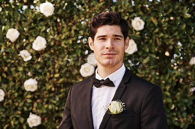 Buy stock photo Cropped portrait of a handsome young bridegroom looking thoughtful while standing outdoors on his wedding day