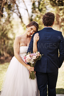 Buy stock photo Cropped shot of an affectionate young bride smiling while leaning on her groom's shoulder on their wedding day