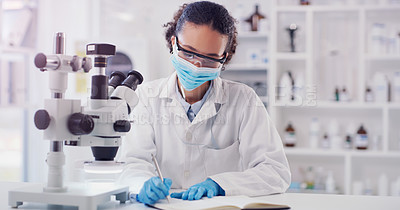 Buy stock photo Scientist, woman writing and lab worker with medical research and face mask in a clinic. Data work, planning and working of a young female employee with a notebook and microscope results for science