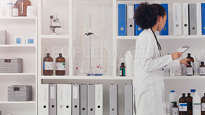 Buy stock photo Woman, scientist and checklist for inventory in lab stock room for equipment check and analyse products. Female pharmacist, clipboard and bottles chemical supply in laboratory for research and work