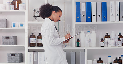 Buy stock photo Woman, scientist and clipboard for inventory in lab stock room for equipment check and analyse products. Female pharmacist, checklist and bottles chemical supply in laboratory for research and work.