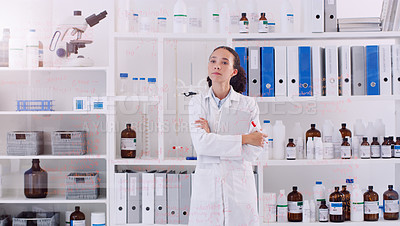 Buy stock photo Shot of a young scientist looking at the notes written on a glass wall in a lab