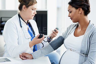 Buy stock photo Blood pressure, healthcare and doctor with a pregnant woman for a consultation of health. Hospital, wellness check and a medical worker with a patient consulting about hypertension during pregnancy