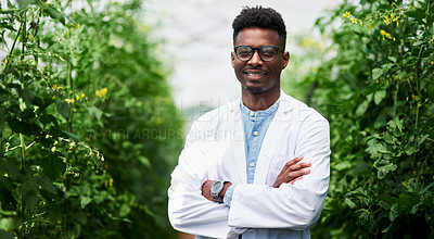 Buy stock photo Portrait of a handsome young botanist posing with his arms folded outdoors in nature