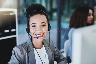 Buy stock photo Cropped portrait of an attractive young businesswoman sitting in the office with her coworkers and wearing a headset
