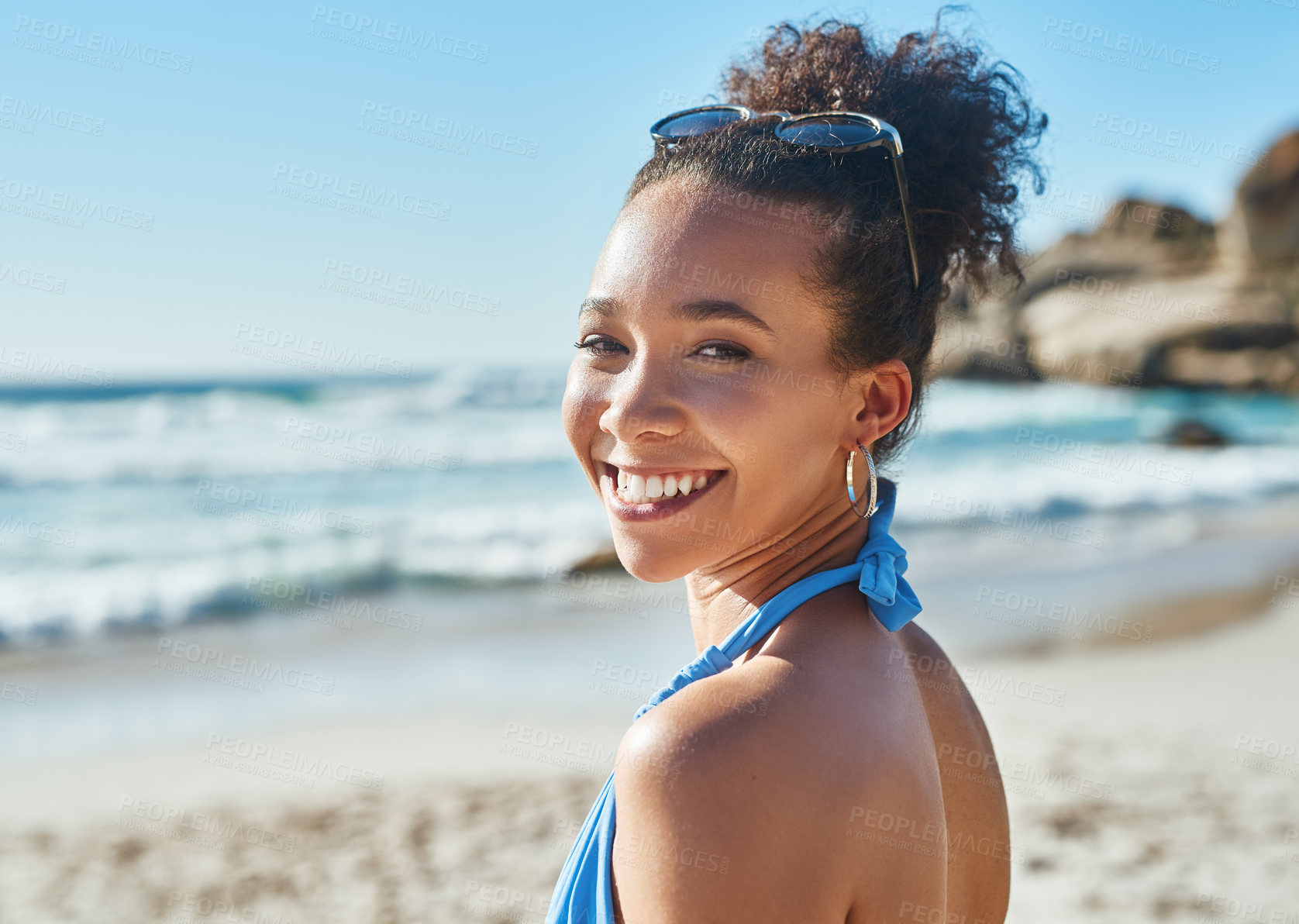 Buy stock photo Portrait of a beautiful young woman enjoying a summer’s day at the beach