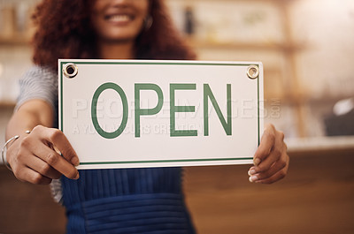 Buy stock photo Open sign, hands and woman in small business, store and advertising news of retail shopping time, banner and trading information. Closeup, shop owner and board for opening, welcome and cafe signage