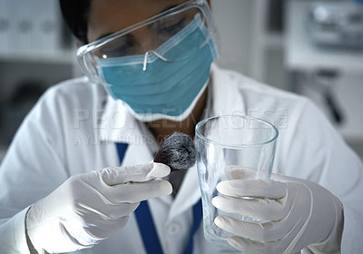 Buy stock photo High angle shot of a female forensic scientist dusting for prints in the lab